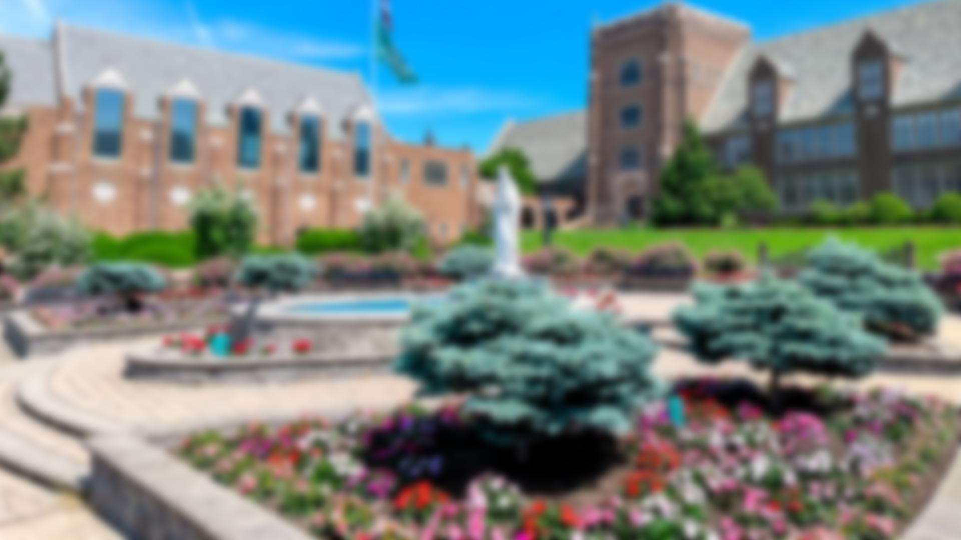 Blurred image of mary garden and old main
