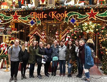 Students pose outside during a christmas celebration abroad